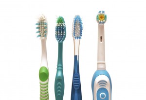 Photo of manual and electric toothbrushes