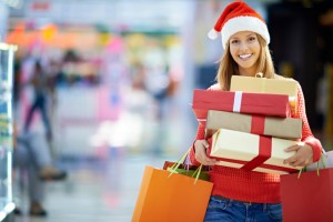 woman smiling holding presents 